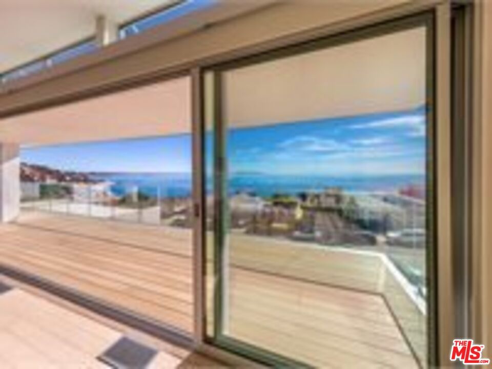 Fabulous custom built in 2020 home with spectacular panoramic views from Palos Verdes to Malibu. Enjoy the home from your private elevator. Lower level consists of three end suite bedrooms, all with ocean views and custom baths. Laundry room and elevator are also on this level. Upper level is the main entry to the home, featuring 9-11 foot ceilings, living, dining and family rooms, all with unobstructed panoramic ocean views. Enjoy the partially covered deck, again with ocean views. The kitchen has Fisher/Pykel appliances, two zone wine cooler and a microwave drawer. Custom mechanical cabinets, large pantry and 8 foot bar. There is a patio with w/bbq hookup off the kitchen. The living room has 11 foot ceilings and a floating stairway. Fleetwood sliding doors lead to the deck. Motorized window coverings and bamboo floors throughout. Direct entry from your private garage.
