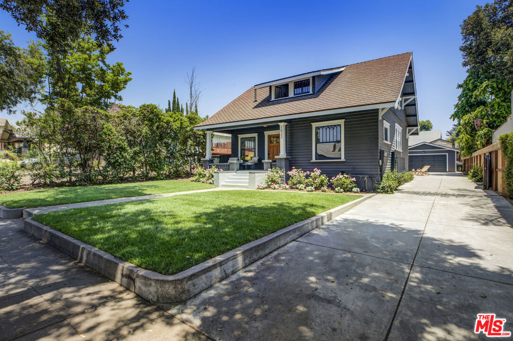 Craftsman Charmer in Coveted Garfield Heights. Welcome to 1022 Marengo Avenue, a two-story Craftsman bungalow on a picturesque tree-lined street in Pasadena's sought-after Garfield Heights neighborhood. This four-bedroom, two-bath home sits on a generous lot with endless potential. The main house is filled with original character, from hardwood floors to vintage windows that flood the space with natural light. The formal living and dining rooms flow into a bright, spacious kitchen, complete with brand new stainless steel appliances, a dedicated laundry room and access to the expansive backyard. One bedroom and a full bath are located on the main level ideal for guests or a home office. Upstairs, you'll find three more bedrooms and a half-bath, with room to expand or reimagine the space to suit your needs. Out back, the detached two-car garage offers incredible flexibility, think office, studio, or future ADU. And the oversized backyard? It's just waiting for a pool, garden, or play area. Imagine coming home to your reimagined architectural gemstone of a property and retreating behind the gates to your own private sanctuary, where charm, space, and potential all come together.