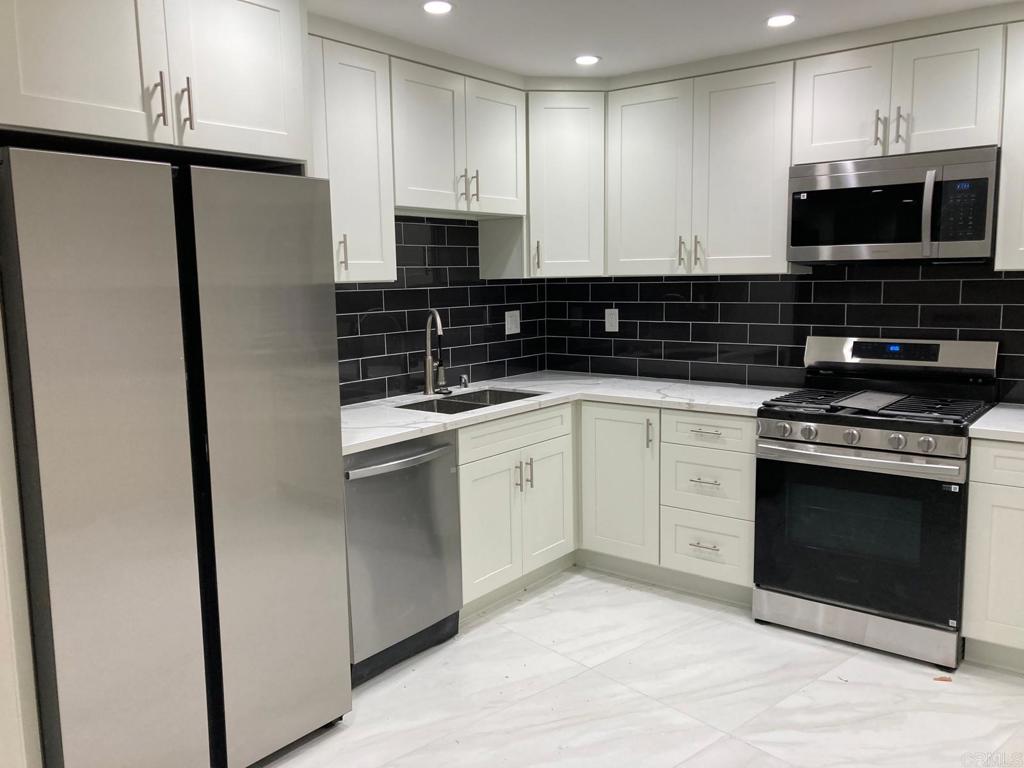 Take advantage of our move-in promotion!! Coastal Living, fully remodeled coastal elegance, this 2-story apartment has 2 bedrooms and 1.5 bathrooms. Enjoy an open-concept living space featuring a brand-new gourmet kitchen, equipped with stainless steel appliances (refrigerator, dishwasher, microwave, and stove). Unwind in the stylishly remodeled bathrooms and appreciate the sleek, low-maintenance flooring throughout. An electric fireplace warms the living room on cooler evenings, while the in-unit washer and dryer provide ultimate convenience. Bask in the ocean breeze and enjoy an easy walk to local shops and schools. This unit includes a shared 1-car garage. Schedule your showing today! This turnkey gem is ready for you.