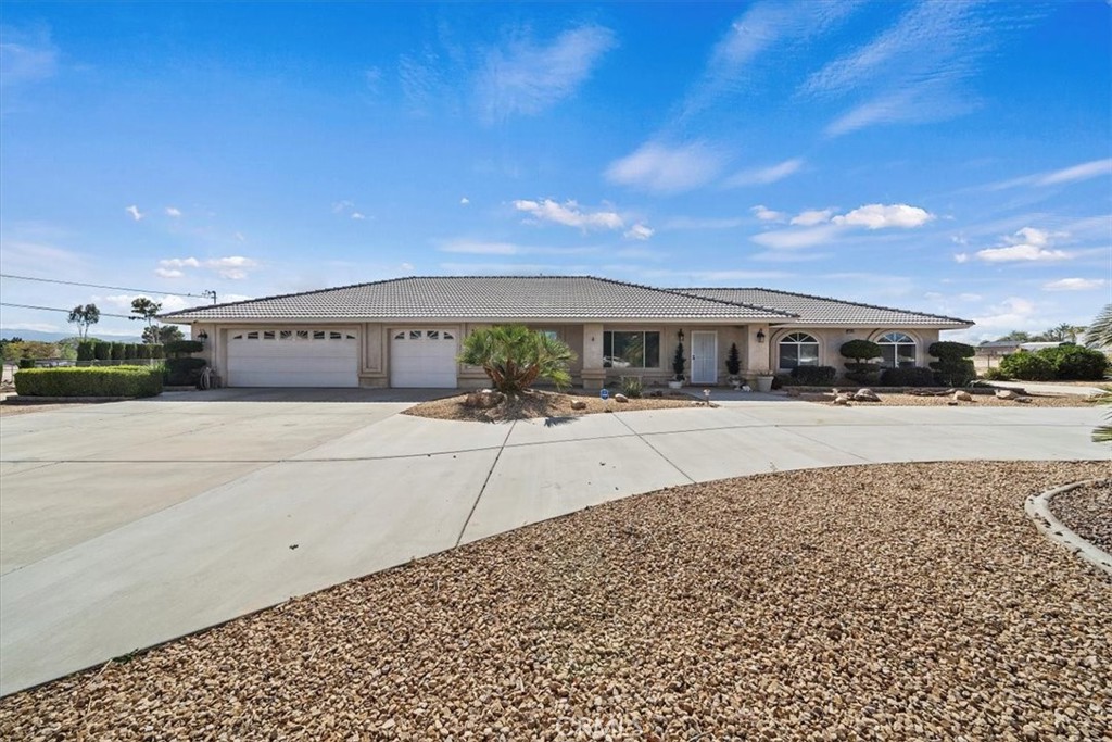 Welcome to this stunning 4-bedroom, 2-bathroom home in Hesperia, set on nearly 1.5 acres. The open, newly remodeled kitchen with a cozy nook flows seamlessly into the family room, living room, and dining area, perfect for both everyday living and entertaining.
The property features a three-car attached garage, circular and side concrete driveways, and beautifully landscaped grounds that enhance its curb appeal. Enjoy serene mountain views and quick access to the 15 Freeway from this quiet location.
A spacious, fully equipped workshop adds incredible versatility, with two large roll-up doors, a side entrance, 110/220V power, water, interior sink, concrete floors, built-in shelving, workbenches, fluorescent lighting, and full drive-around access. Multiple drive-through gates provide ample space for RV entry and storage, both inside and outside the workshop, offering endless potential for work, living, or cash flow opportunities.
This home combines comfort, functionality, and versatility perfect for families seeking space and possibilities. Don’t miss this opportunity to own this gem!