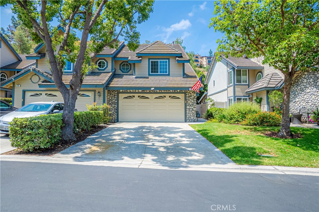 Welcome to 242 Crawford Canyon #21 Orange, CA! Located in a gated community of Stonehenge in the hills of Orange. This large 1700 + Sq Ft. Townhome boasts 3-bedrooms and 2.5-bathrooms townhome including a 2-car garage, driveway, and back patio/garden area. Bright open floor plan with cathedral ceilings. The dining room is open to the large living room with fireplace. Upstairs you have a large primary bedroom with a private bathroom and great closet space. Spacious Guest rooms and one bedroom can be used as a den or bedroom. Laminate floors and Carpet Throughout and this home has been very well taken care of. Stonehenge offers a gate, pool, tennis court and more. Close to shopping, freeways and restaurants including Orange County Mining Co. and Orange Hill Restaurant where you can enjoy breathtaking views. Close to parks and hiking trails as well. Hurry up and grab this townhome before its gone. Buyer to do own due diligence, no guarantees from Seller or Listing Broker.
