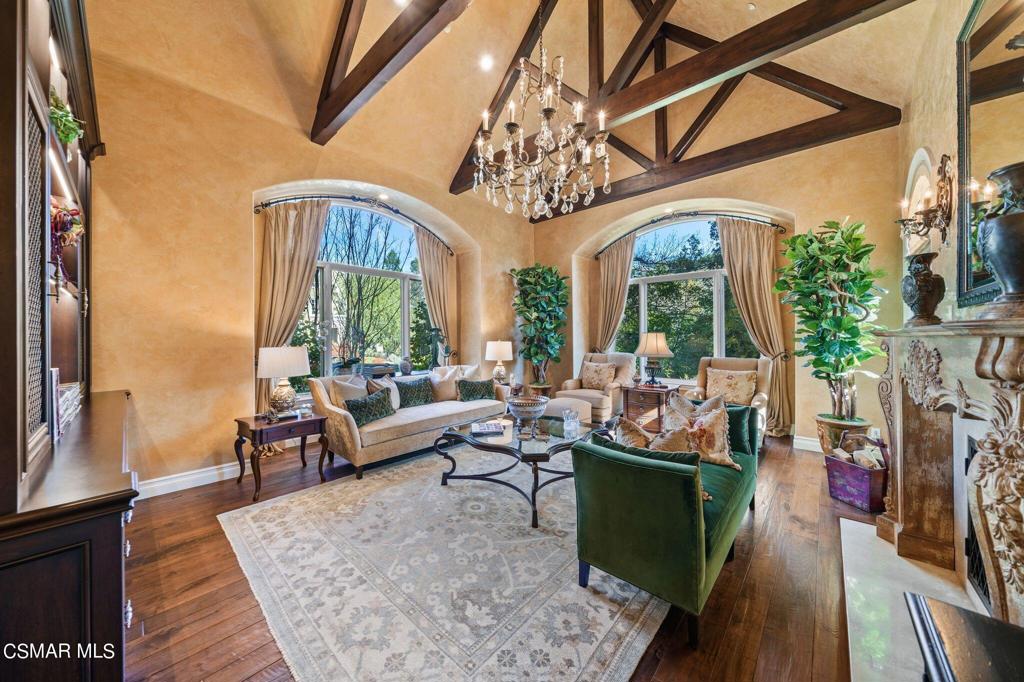 Exquisite French traditional with a premier location in guard gated North Ranch Country Club Estates! Boasting panoramic fairway and mountain views is this timeless custom estate! Interior features include a grand two story entry with sweeping curved staircase. Other features include a remarkable formal library/office with fireplace, billiards room, and a gorgeous remodeled dream center island kitchen. There are four bedrooms upstairs and one down. The grounds are absolutely stunning! There is a custom pebble tech pool and spa, barbecue center, large covered patio, outdoor fireplace and manicured lawns all with total privacy and views! other amenities include a FIVE car garage, leaded glass windows, koi and turtle ponds and much more!