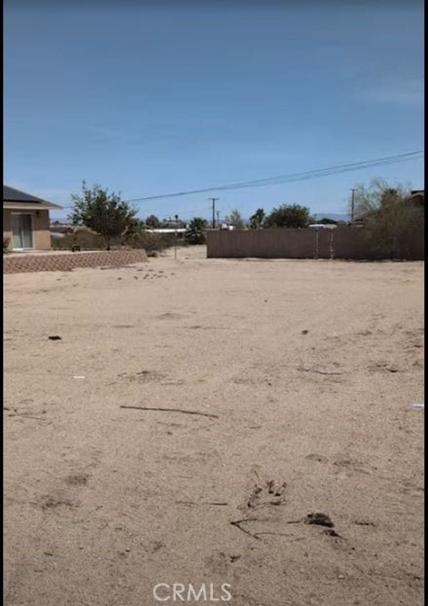 Prime West-Facing Lot in Smoke Tree – Ready to Build!



Discover the perfect canvas for your desert dream home in the sought-after Smoke Tree neighborhood of 29 Palms. This flat, scraped, and graded lot is construction-ready, offering a seamless path to development with utilities available at the street.



Ideally located just minutes from downtown 29 Palms and the transformative Project Phoenix—featuring the upcoming Joshua Tree National Park Visitor Center and Community Center—this property places you at the heart of a vibrant and evolving community.



Enjoy panoramic views of the iconic 49 Palms Canyon right from your front yard, a rare and breathtaking vantage point into one of Joshua Tree National Park’s most beloved inlets. Whether you're seeking a serene retreat or a strategic investment in the Morongo Basin, this lot delivers location, potential, and natural beauty in equal measure.