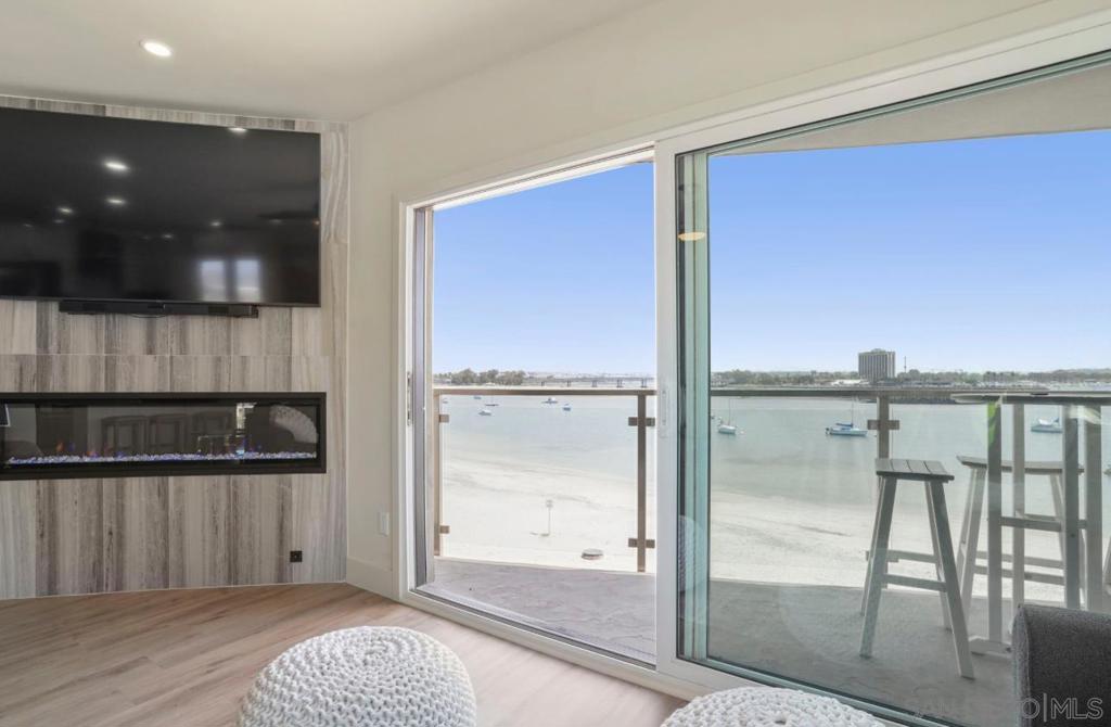 BAY FRONT PENTHOUSE WITH STUNNING VIEWS!! Welcome to your dream coastal retreat! This beautiful, modern, remodeled, light-filled 3-bdrm, 2bth, penthouse offers 1,190 sq ft of serene luxury with breathtaking bay views and a unique 2-car detached garage! Enjoy the calming sea breeze and panoramic sunsets from your top-floor sanctuary. Whether you're relaxing at home or entertaining, the modern, open layout and natural light make this space truly special. Located just steps from the water, you'll have easy access to water sports, jet skiing, scenic parks, popular restaurants, and charming cafés—all just outside your door. If you're looking for a bayfront lifestyle w/ the best views San Diego has to offer, convenience, and coastal charm, this is the home for you!
