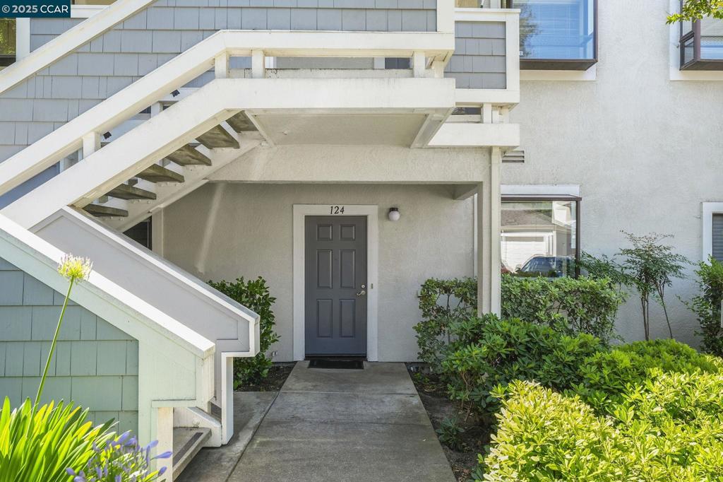 Welcome to 2584 Oak Road #124 — a charming ground-floor condo in the desirable Ashford Court community of Walnut Creek. This fresh, clean 2-bedroom, 2-bath home offers the perfect blend of comfort, convenience, and location. The spacious living and dining area features 9-foot ceilings, a cozy fireplace, and access to a private patio—ideal for relaxing or entertaining. The bright kitchen includes stainless steel appliances and in-unit laundry for everyday ease. Both bedrooms are generously sized with ample closet space. The primary suite offers an ensuite bath and access to a second private patio. Additional highlights include air conditioning, abundant interior and exterior storage, a detached one-car garage, and nearby guest parking. Enjoy beautifully maintained grounds, a sparkling community pool, and a location close to Walden Park and the Iron Horse Trail. You're also minutes from BART, freeways, top-rated schools, and all that downtown Walnut Creek has to offer. Don’t miss this fabulous opportunity in one of the East Bay’s most convenient communities!