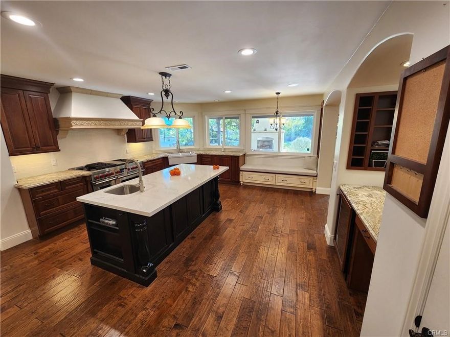 Discover an exceptional rental opportunity at 26061 Via Viento, where refined living meets practical elegance in Mission Viejo's prestigious neighborhood. This remarkable 4-bedroom, 3-bathroom residence spans 3,493 square feet across two thoughtfully designed levels, offering an unparalleled blend of luxury and functionality.



The main floor showcases a dramatic living room featuring soaring vaulted ceilings, exposed beam work, and a gas fireplace, complemented by built-in storage solutions. The adjacent dining room boasts a charming bay window and French door access. The chef's kitchen stands as the home's centerpiece, equipped with a brand-new 48-inch dual-fuel Wolf range, Cambria Quartz countertops, and an expansive island with secondary sink. Additional amenities include a walk-in pantry, built-in desk area, and beverage center. The kitchen flows seamlessly into the family room, complete with a second fireplace and surround sound system.



Upstairs, discover a sun-filled loft with built-in desk space and the luxurious master suite featuring vaulted ceilings, authentic wood beams, and a fireplace. The master bathroom includes dual vanities, jetted tub, and separate shower. Two additional bedrooms offer generous proportions and walk-in closets, with one providing balcony access.



The property's outdoor spaces rival any resort, featuring a covered patio with outdoor fireplace, built-in BBQ bar seating eight guests, pergola-covered areas, basketball court, and mature fruit trees across approximately one-third acre.



Conveniently located near Pavilions grocery store, Mission Viejo High School, and Cox Sports Park, with excellent freeway access and award-winning schools nearby.