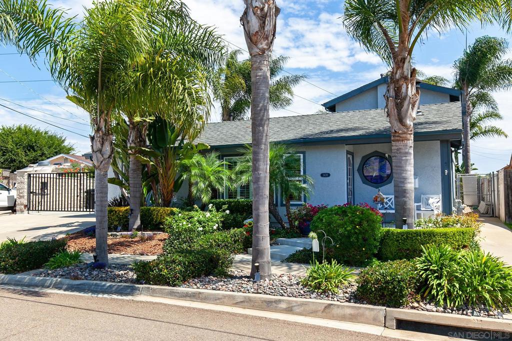 Welcome to this rare canyon property in the heart of San Diego! The North Clairemont property is nestled on an expansive 0.74-acre lot. The home offers nearly 2,000 sq. ft. of living space with 3 bedrooms, 2.5 bathrooms, and a flexible 4th bedroom or family room option. A true highlight is the detached 1,000 sq. ft. structure featuring an oversized 3 car garage with finished interior, 4 skylights, two 8-foot roll-up garage doors, two man doors and a separate office, and storage room. An automatic gate leads to a large courtyard between the home and detached garage structure with ample additional parking, including room for RV parking. The moment you step inside, vaulted ceilings, a beautiful stained-glass window, and a cozy pellet stove create a warm and welcoming ambiance. The primary suite occupies the second story, providing stunning canyon views, a beautifully updated bathroom with custom vanity, and a walk-in closet. Two additional bedrooms are located downstairs along with an optional 4th bedroom, currently being used as a family/media room. Both downstairs bathrooms have also been thoughtfully renovated for modern comfort. Additional features include fully paid solar system, 200 AMP electrical panel, recessed lighting, dual-paned windows with custom window treatments including plantation shutters plus a tankless water heater for efficiency. Step outside to the secret garden and discover your private oasis along the canyon. The property boasts a meticulously landscaped yard and a bountiful orchard with Santa Rosa Plum, Pluot (plum/apricot hybrid), Tangerine, Lemon, Lime, Naval Orange, Valencia Orange, and Avocado trees—perfect for enjoying seasonal harvests. Centrally located, this home is just 15 minutes from downtown and the airport, and only 10 minutes to beaches, SeaWorld, and top San Diego attractions. A rare blend of space, convenience, and natural beauty, this property is a true gem in the desirable North Clairemont neighborhood.
