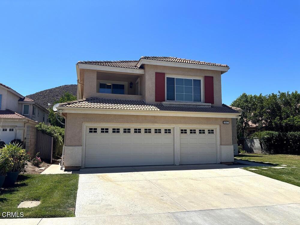 Located on a cul-de-sac, this 5 bedroom, 3 bathroom 2,571 sq. ft. home features high ceilings and light/bright interior - all in a great neighborhood! This home features two balconies and hardwood flooring in the hall, kitchen and family room. The kitchen has plenty of cabinetry, a walk-in pantry, center island and is open to the family room which offers a fireplace and views of the backyard. The upstairs master bedroom has a vaulted ceiling, balcony overlooking the backyard, two walk-in closets, and the main bathroom offers two vanity areas, oversized tub & separate shower.The 3 bedrooms upstairs share a full bathroom and there is another balcony which overlooks the hills. On the ground floor there is a bedroom, bathroom, indoor laundry room and direct access to the 3-car garage. This home features a multi-zone air conditioning system with 4 control units for individual temperature preferences, especially economical for a 2-story home. Just a 0.4 mile walk to Stargaze Park and minutes from local shopping!