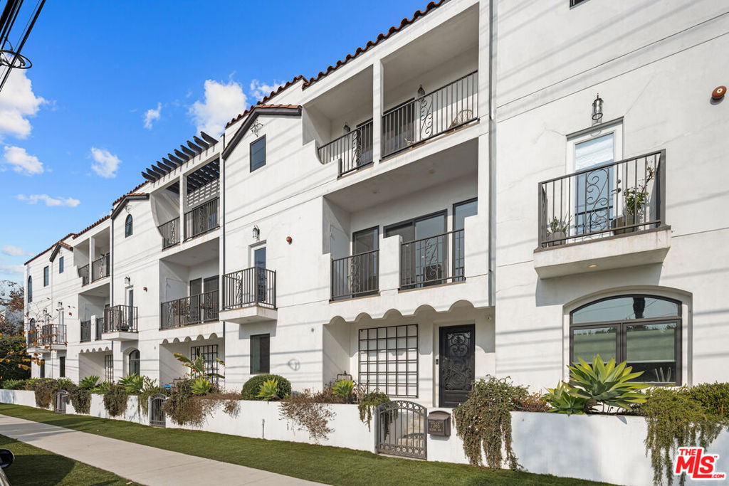 Experience modern living at this 2021-built, tri-level home in the heart of West Hollywood. With 3 bedrooms and 2.5 baths, this light-filled residence offers sleek finishes and thoughtful design. The open-concept living area features a chef's kitchen with stainless steel appliances, Caesarstone countertops, custom cabinetry, and a wine fridge, flowing into a spacious dining area and balcony. The primary suite boasts dual closets, a luxurious en suite bath, and a private balcony. Two additional bedrooms share a Jack-and-Jill bath. French oak flooring, skylights, and an in-unit washer/dryer add to the home's style and convenience. A two-car garage provides security and storage, while the unbeatable location offers easy access to WeHo's vibrant cafes, shops, and nightlife, as well as nearby studios and the Hollywood Bowl.