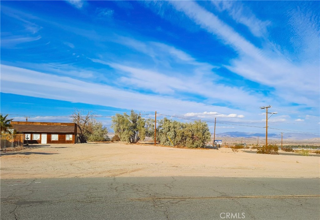 Commercial corner-Top Location, and one of the few commercial lots, avialable in Twentynine Palms. On Adobe Road, major pathway to the Twentynine Palms Marine Base. Good central loation, near many business's. The Tortoise Rock Casino & the Phoenix Project are nearby. Parcel is sold for land value only, as buildings have no value.APN 0621-131-06 & 02 & 01. APN 0621-142-04