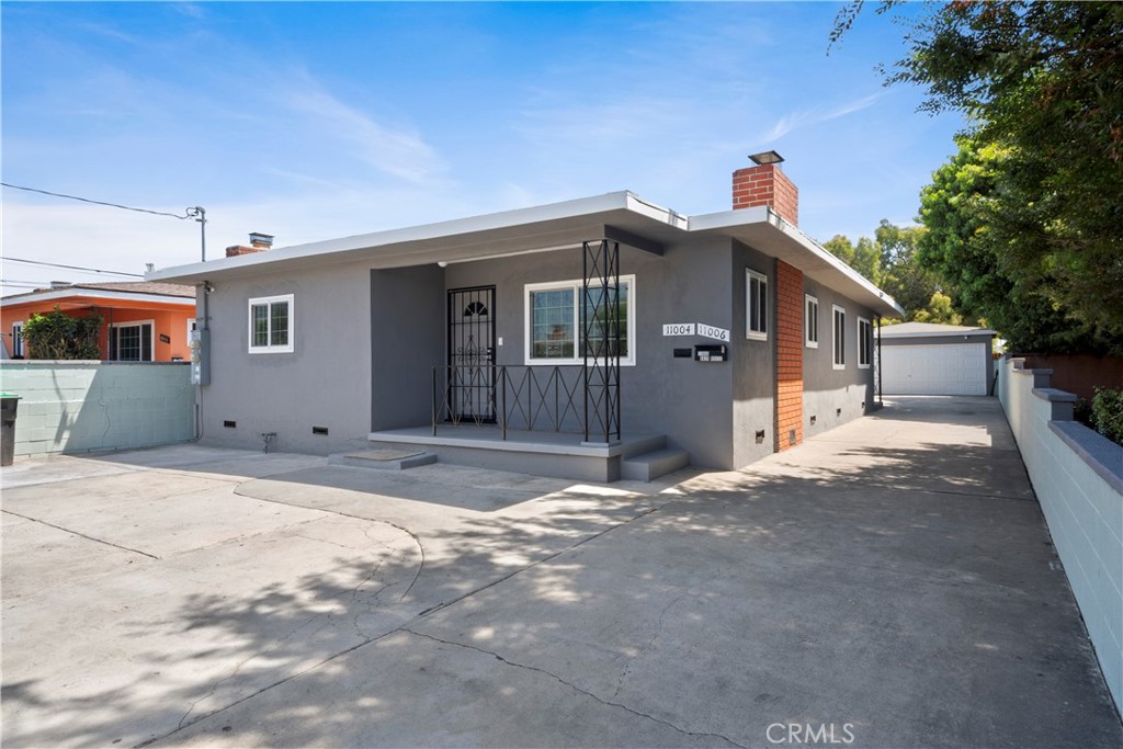 Welcome to 11004 Mansell Avenue — a beautifully updated duplex offering modern comfort, functional design, and excellent income potential. With two separate homes on one lot, this property is perfect for owner-occupants, investors, or multi-generational living.
The front unit features 3 spacious bedrooms and 2 upgraded bathrooms. Inside, you'll find fresh interior paint, a generously sized kitchen with granite countertops, recessed lighting, ample cabinet space, and a dedicated dining area. The unit also includes a private laundry room for added convenience.
The rear unit is a charming 1-bedroom, 1-bath home with a renovated bathroom, granite kitchen counters, and its own washer/dryer hookups — ideal for rental income, guests, or extended family.
Both units are equipped with double-pane windows for energy efficiency and newer heating and A/C systems to ensure year-round comfort. The exterior of the property has been freshly painted and includes a spacious backyard, detached garage, and multiple parking spaces — perfect for outdoor enjoyment, storage, or future expansion. There is also potential for an ADU addition in the rear (buyer to verify).
Located near major freeways (105, 110, and 405) and just minutes from LAX, this property offers unbeatable convenience for commuters. You're also within a short drive to top local attractions such as the new Intuit Dome, SoFi Stadium, the Kia Forum, and Hollywood Park Casino — plus only 15 minutes from the beach.
Whether you're looking to generate steady rental income, accommodate extended family, or invest in future development, 11004 Mansell Avenue is a rare opportunity in a highly desirable location.
