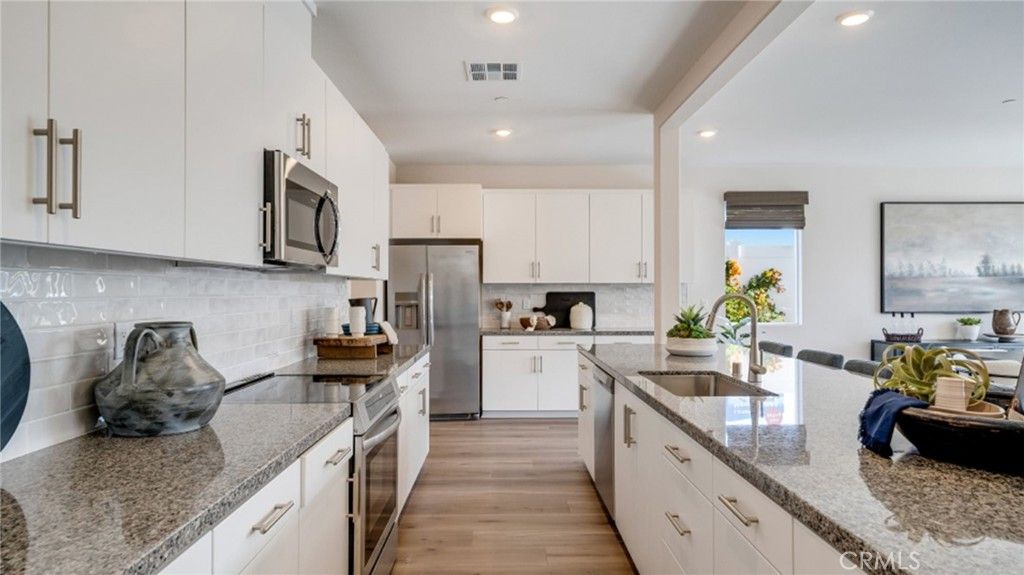 Photo of 2392 Peach Tree Lane, Perris, CA 92570 (MLS # SW26015564)