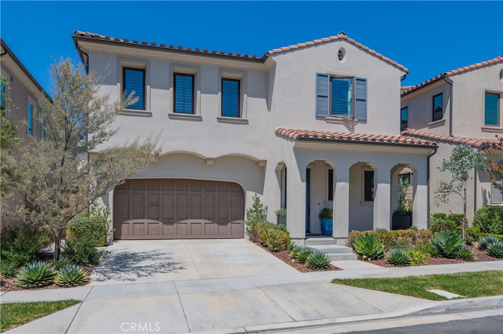 Located in the exclusive 24-hour guard-gated community of The Groves at Orchard Hills, this elegant Padova Italian-style residence offers comfort, luxury, and convenience. The home features 4 bedrooms, including a private guest suite on the main level, plus an upstairs entertainment loft—perfect for family living and visiting guests. The open-concept floor plan showcases a gourmet kitchen with an expanded chef’s island, quartz countertops with designer backsplash, professional-grade GE Monogram stainless steel appliances, custom pendant lighting, and abundant cabinetry. Filled with natural light, the interior is enhanced with plantation shutters, custom paint, and designer finishes throughout. The spacious master suite includes a luxurious spa-style bathroom and a walk-in closet. The inviting great room flows seamlessly into a charming conservatory and leads to a generously sized backyard featuring low-maintenance turf, professional landscaping, and a built-in firepit—ideal for outdoor entertaining. Community amenities include swimming pools, Jacuzzi, clubhouse, BBQ areas, tennis courts, and multiple parks. Conveniently located near Orchard Hills Shopping Center and within the award-winning Orchard Hills School District, this home offers the best of Irvine living.