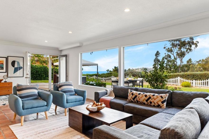 Panoramic ocean views and single-level living await in this 4-bedroom La Jolla retreat. Perched on a half-acre lot in Hidden Valley / Via Capri, this home offers sweeping vistas of La Jolla Shores and the Pacific from the living room, primary suite, and expansive backyard. The bright, open layout features a fully equipped kitchen, spacious game/media room with 55" TV and foosball, and four well-sized bedrooms. Outdoor living shines with a firepit, hot tub, and plenty of space for entertaining or relaxing while enjoying sunsets over the ocean. Additional highlights include generous parking for multiple vehicles and a pet-friendly design. Ideal for those seeking a blend of coastal serenity and convenience, with easy access to beaches, village shops, dining, and nearby trails like Torrey Pines.
