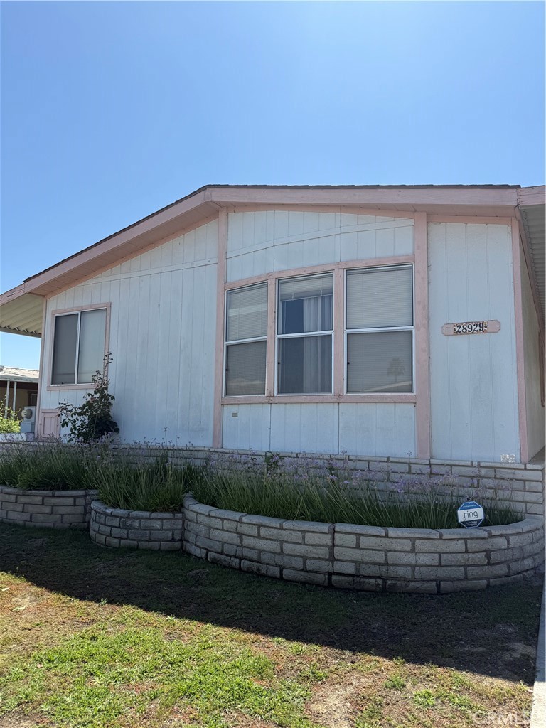 PERMANENT FOUNDATION IS INSTALLED AND PERMIT IT RECORDED
55+ SPRING KNOLLS COMMUNITY IN MURRIETA HOT SPRINGS. WELCOME TO THIS 2 SPACIOUS 2 BDRM,2 BATH MFG HOME BUILT IN 1989 LOCATED IN THE HIGHLY DESIRABLE SPRING KNOLLS ASSOCIATION. ENJOY A PEACEFUL LIFESTYLE WITH STUNNING PANORAMIC VIEWS OF THE SANTA ROSA MOUNTAINS FROM THE LARGE COVERED FRONT PORCH, PERFECT FOR RELAXING AND ENJOYING THE BEAUTIFUL SCENERY. STEP INSIDE TO A BRIGHT AND OPEN LIVING AREA WITH VAULTED CEILINGS AND NEWER VINYL PLANK FLOORING, SEAMLESSLY CONNECTED TO A FORMAL DINING ROOM COMPLETE WITH A BUILT IN HUTCH. ADJACENT TO THE LIVING ROOM IS A COZY FAMILY ROOM OR TV ROOM THAT CAN EASILY BE INCORPORATED TO EXPAND YOUR MAIN LIVING SPACE. THE KITCHEN OFFERS AN INVITING DINETTE/EATING AREA AND A STYLISH DIVIDER WITH BUILD IN SHELVING, PERFECT FOR EXTRA STORAGE OR DISPLAYING YOUR FAVORITE DECOR. A CONVENIENT SEPARATE INDOOR LAUNDRY ROOM FEATURES EXTERIOR ACCESS AND CONNECTS DIRECTLY TO THE SECONDARY BATHROOM WITH INCLUDES A TUB AND SHOWER FOR ADDED GUEST COMFORT. THE SPACIOUS PRIMARY BEDROOM WITH VAULTED CEILINGS FEATURES A WALK IN CLOSET AND A PRIVATE ENSUITE BATH WITH BOTH A SOAKING AND JETTED TUB AND A SEPARATE SHOWER. THE LOW MAINTENANCE FRONT AND BACKYARD ARE BEAUTIFULLY LANDSCAPED WITH FLOWERING PLANTS, LUSH GREENERY AND VIBRANT ROSES, IDEAL FOR EASY LIVING AND OUTDOOR ENJOYMENT. CLOSE TO THE CLUBHOUSE WITH 2 COMMUNITY POOLS, SPA, EXERCISE ROOM AND VIBRANT SOCIAL SCENE. LOCATED NEXT TO THE RECENTLY OPENED MURRIETA HOT SPRINGS DAY SPA. MURRIETA HAS AN ABUNDANCE OF SHOPPING AND IS NEAR TEMECULA, OLD TOWN AND MANY WINERIES JUST UP THE ROAD. DON'T MISS YOUR CHANCE TO OWN THIS BEAUTIFUL HOME IN ONE OF MURRIETA'S MOST SOUGHT-AFTER 55+ COMMUNITIES WHERE YOU OWN THE LAND. MOVE IN READY. SCHEDULE YOUR SHOWING TODAY. SEE REMARKS.