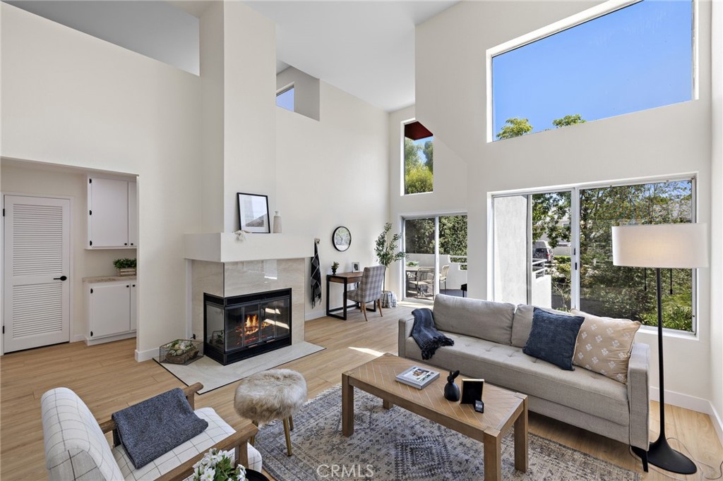 This beautifully remodeled 2-bedroom, 2-bathroom condo at 26914 Jasper #254 in Mission Viejo offers the perfect blend of modern upgrades and convenience. Fresh paint, upgraded flooring, and stylish cabinetry create a bright and contemporary living space, while high ceilings and abundant natural light give the home an open, airy feel. The living room features a tiled fireplace and sliding doors that lead to a private outdoor patio, ideal for relaxing or entertaining.
The kitchen is a true showpiece, fully remodeled with new cabinetry, custom hardware, sleek quartz countertops, and new appliances. The spacious primary bedroom offers a walk-in closet and a stunning remodeled bathroom with a designer mirror, contrasting hardware, and updated shower doors. Upstairs, the loft-style second bedroom includes its own bathroom and walk-in shower, making it perfect for guests, family, or a home office.
Additional highlights include a detached garage, plenty of guest parking throughout the community, and access to the Hillcrest Community amenities, including a sparkling pool and spa. With its close proximity to Mission Hospital, freeway access, and The Shops at Mission Viejo, this home combines modern finishes, thoughtful design, and a highly desirable location, making it a true gem in Mission Viejo.