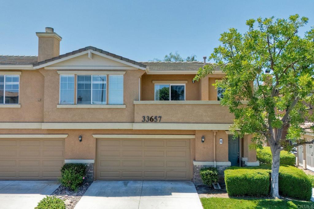 This three-bedroom condominium is perfectly situated in the beautiful gated community of Redhawk in Temecula. The private subdivision offers wonderful amenities including a community pool, spa, playground, and picnic area. Inside, the floor plan is well laid out and functional, featuring an office nook at the top of the stairs and an open-concept dining, kitchen, and family room with a cozy fireplace. The kitchen is equipped with stainless steel appliances, a gas cooktop, and ample countertop space. The primary suite features dual vanity sinks, a large walk-in closet, and a soaking tub. Additional highlights include indoor laundry, a spacious balcony perfect for enjoying your morning coffee, and a large attached two-car garage. Located within award-winning school boundaries including Tony Tobin Elementary, Vail Ranch Middle School, and Great Oak High School. Close to shopping, wineries, and Old Town Temecula.