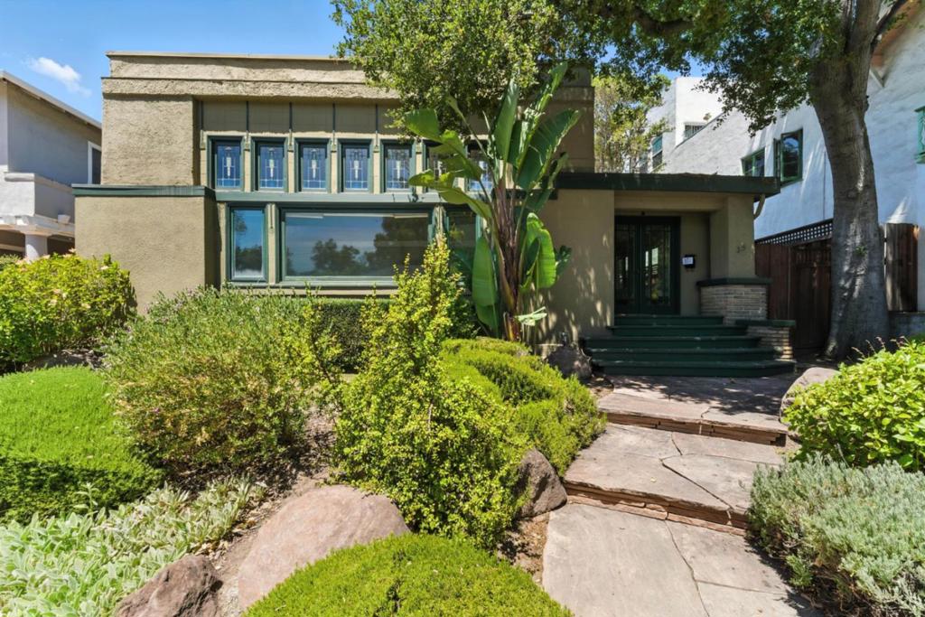 Immaculate 1912 Prairie-style masterpiece by famed architect Frank Delos Wolfe, built for Charlotte & William Atkinson, now thoughtfully expanded & renovated for modern living. This rare architectural gem at 35 Hawthorne Way showcases signature horizontal lines, overhanging eaves, stained glass & flowing interiors, complemented by a new upstairs primary suite retreat. The Sub-Zero/Dacor updated kitchen, owned solar w/Tesla Powerwall, heat-reflective roof, & central A/C provide green efficiency. The attached 2-car garage leads to a finished, usable basement that offers versatile storage, hobby, or wine space.The fenced backyard features a decked area & entertainers patio, ideal for gatherings. Located in San Josés historic Vendome neighborhood, youre moments from Japantowns celebrated restaurants, San Pedro Square Market, & downtowns museums, theaters, & festivals. A perfect harmony of architectural heritage & contemporary comfort in one of the citys most sought-after enclaves.