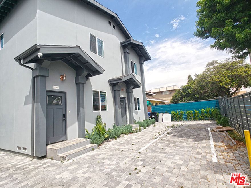 BRAND NEW 2021 BUILT!!!  High quality ONE of fourplex in prime Mid-Wilshire location. Boasting 10ft High ceiling, extremely LOW electric bill (thanks to 3.3KW Solar system), Tankless water heater, central A/C, modern custom kitchen, premium appliances, wood floors, in-unit washer/dryer, and plenty of open living space, Fancy rolling window blinds, intercom system and New LG washer/Dryer in unit. This deluxe property is located minutes from Larchmont Village, Hollywood, Korea town where many entertainment jobs and opportunities are offered. Open layout single floor plans is now available 1st floor. 2 car parking with 220V outlet for EV charging. Monthly rent is $3,600/mo. less $200 for first 12 months, Net total monthly rental will be $3,400/mo.