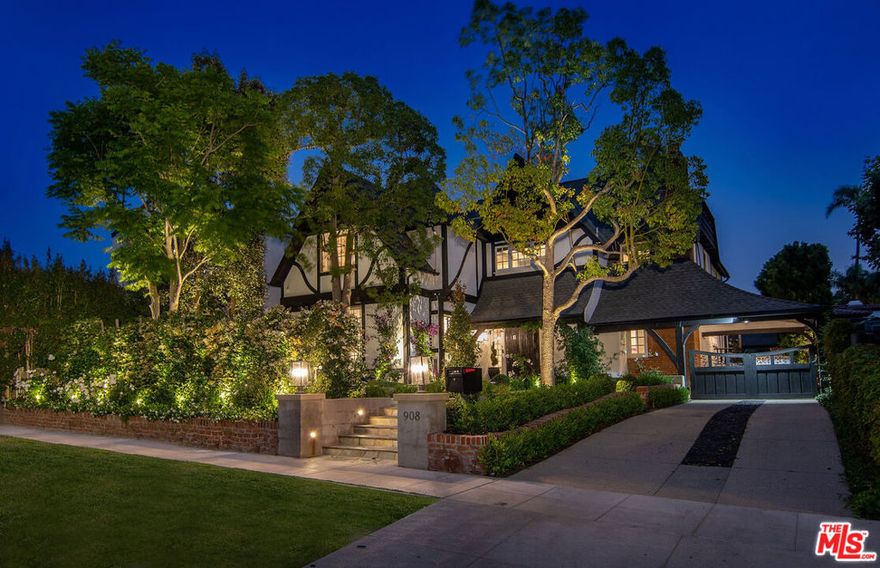 Nestled in the heart of Little Holmby and within the coveted Warner Avenue School District, this beautifully preserved Tudor Revival home perfectly balances timeless elegance with modern comfort. Sunlight pours through leaded-glass windows, illuminating rich hardwood floors, coffered ceilings, and a marble fireplace that anchors the formal living room. A dramatic staircase leads to a serene primary suite with a walk-in closet and a spa-like bath, while two additional bedrooms provide warmth and character. The converted garage offers flexibility as an office, gym, or studio, complemented by custom built-ins, updated lighting, and lush landscaping that enhances privacy and curb appeal. A rare offering in one of L.A.'s most treasured neighborhoods where architectural charm and modern living coexist beautifully.