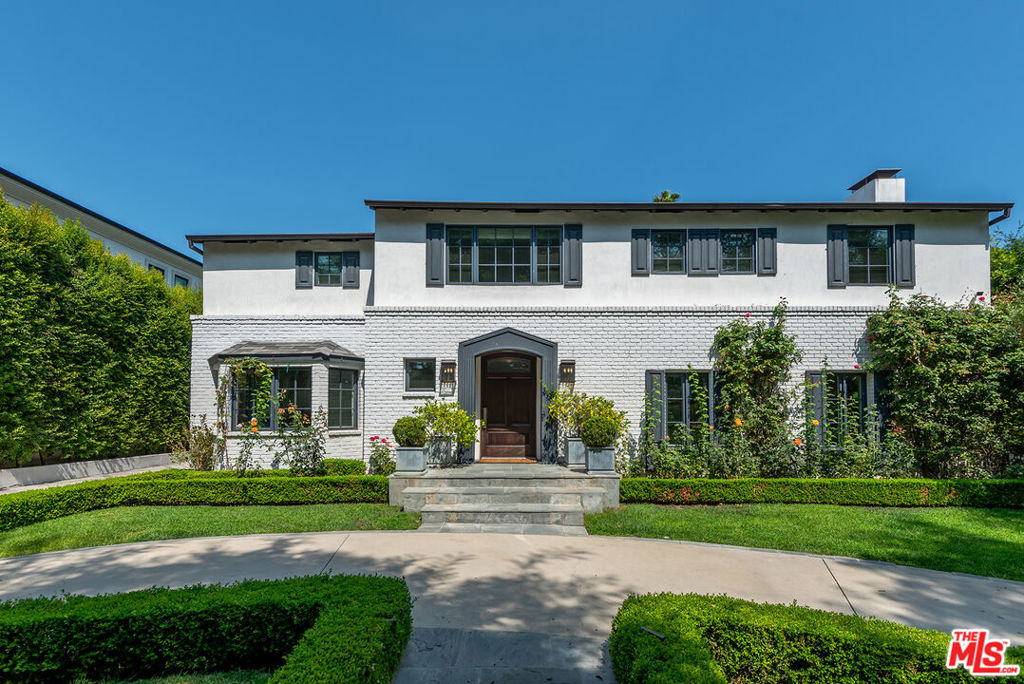 Gated 2-story Traditional in prime Beverly Hills located on legendary Roxbury Drive. Great family home offering 6 bedrooms and 7 baths. Completely redone with incredible attention to detail. State-of-the-art kitchen with enormous center island and adjoining breakfast room with bay window, open living room with large wet bar and fireplace, dining room with French doors, and family room with floor-to-ceiling folding doors that lead to lush yard, firepit and patio for al fresco dining. Beautiful grounds with large pool and cabana with kitchenette.