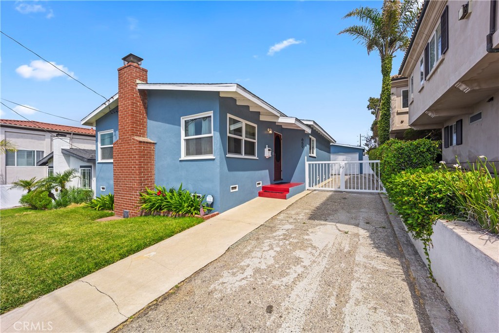 Delightful 3-bedroom 1-bath home in the heart of Hermosa. This is a very attractive home inside and out. There are pristine hardwood floors throughout, and vaulted wood-beam ceilings in the spacious living room that provide a warm, comfortable vibe. The kitchen is updated with stainless steel appliances and butcher block counters. All bedrooms have ceiling fans. One bedroom has been converted into an office with a built-in desk and shelving. Another bedroom opens to the patio and backyard. There is a charming primary bedroom adjacent to the remodeled bathroom. Sitting on a lovely, level, landscaped 4300+ sqft lot, there is plenty of room for outdoor living with a covered patio. The patio table & chairs, and BBQ can remain with the house, and the property still has a large grassy yard. Additionally, there are many potted plants on an automatic drip irrigation system. There is a 2-car garage with room for the washer & dryer. This is an easy bike ride to the beach or a pleasant walk along the greenbelt.