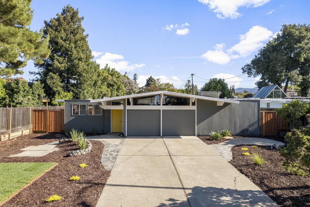Rarely available atrium-model Eichler tucked in the heart of Fairorchard, a historic Sunnyvale neighborhood where Jobs met Wozniak. Located on a quiet cul-de-sac, this thoughtfully updated mid-mod home blends timeless Eichler character w/ smart, modern enhancements. Classic architectural elements include tongue-&-groove ceilings, thinline siding, mahogany paneling, rare oval globe lights, Danish teak shelving, skylights & LVP flooring throughout. A tranquil central atrium welcomes you into light-filled living spaces w/ floor-to-ceiling glass for seamless indoor-outdoor flow. The open-concept layout includes a living room, dining area & functional kitchen w/ curated finishes & ample counter space. The spacious primary suite features sliding doors to the side yard, walk-in closet, and updated en-suite bath. A flexible bonus room nearby is ideal as a sitting room, nursery, or office. Three additional bedrooms share a stylish hall bath with a tile tub-shower combo. The beautifully designed backyard showcases circular patios, pebble-finish concrete & natural rock wallsperfect for entertaining or quiet retreat. Updated baths, skylights & forced-air heating add comfort/convenience. Top Cupertino schools: West Valley, Cupertino, Homestead. Minutes to Tech, Downtown Sunnyvale, 85 & 280.