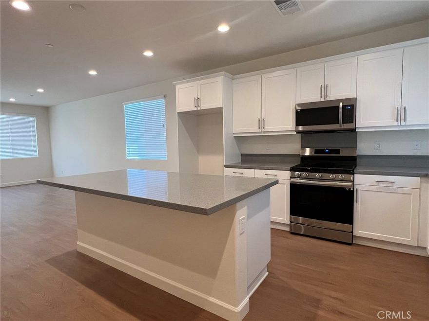 4 BEDROOMS WITH ONE DOWNSTAIRS! 3 BATHS 2,144 SF.GATED COMMUNITY WITH COMMUNITY POOL, SPA, CLUBHOUSE,DOG PARK, PLAYGROUND AND PICNIC AREA!OPEN CONCEPT LIVING WITH 9 FT HIGH CEILING DOWNSTAIRS, KITCHEN FEATURES LARGE ISLAND WITH QUARTZ COUNTERTOPS, WHITE THERMAFOIL CABINETRY, STAINLESS STEEL APPLIANCES AND BEAUTIFUL FLOORING. RECESSING LIGHTING, DIRECT ACCESS TO YOUR 2 CAR GARAGE! YOUR PRIMARY FEATURES SPACIOUS WALK-IN CLOSET, FIBERGLASS TILE SHOWER WITH SEAT, DUAL SINKS WITH CHROME FAUCET AND FIXTURE. TANKLESS WATER HEATER, LED LIGHTS THROUGHOUT. YOU WILL NOT BE DISAPPOINTED!