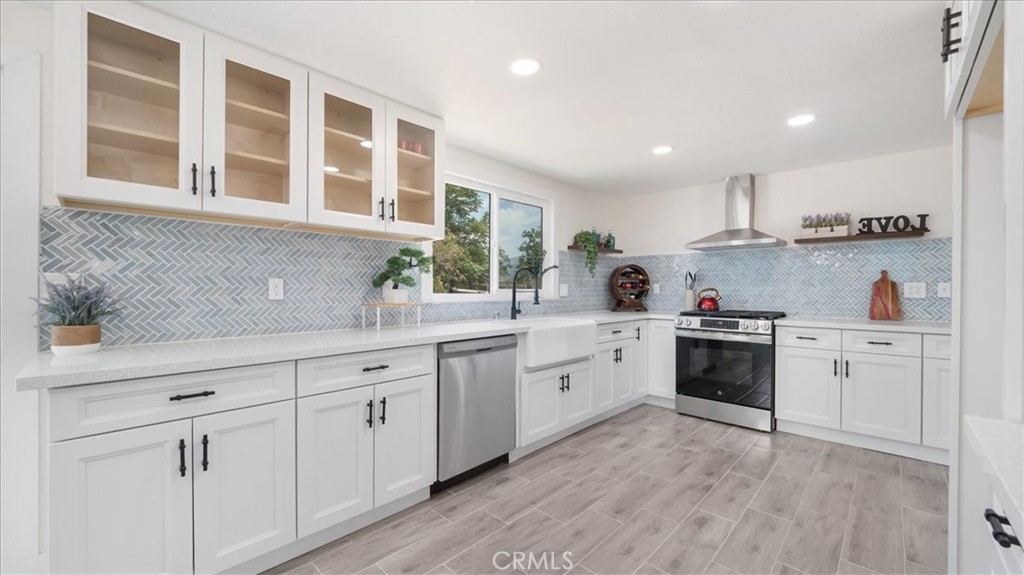 Stunning Remodeled Ranch Home on 1.66 Acres with Mountain Views & Equestrian Facilities Welcome to your dream ranch retreat! Nestled on 1.66 acres of flat, usable land, this beautifully fully remodeled ranch-style home offers modern comfort, timeless charm, and breathtaking views of the San Jacinto Mountains. Step inside to experience ceramic tile flooring throughout, fresh interior and exterior paint, and a new HVAC system with all-new ductwork for year-round comfort. The paid-off solar system and brand-new roof add long-term value and efficiency, while new insulation throughout ensures energy-conscious living. The heart of the home is the newly remodeled kitchen, designed with a modern ranch-style touch—perfect for entertaining and everyday living. The remodeled bathrooms are tastefully appointed, and the primary suite serves as a serene sanctuary with large windows that overlook the open land and equestrian grounds. Enjoy cozy nights by the wood-burning fireplace, and appreciate the convenience of two oversized garage doors with insulated panels—ideal for trucks, trailers, or workshop space. Outside, this ranch is ready for your horses and hobbies. Featuring a 5-stall horse MD barn, tack room, and a dedicated horse training ring, it’s a perfect setup for equestrian enthusiasts or anyone looking to enjoy wide-open country living. With flat terrain and expansive views, there are unlimited possibilities—build an ADU, expand your horse facilities, plant an orchard, or create the retreat of your dreams. This rare gem combines the tranquility of rural life with high-end modern upgrades—all with panoramic views of the San Jacinto Mountains. Don’t miss the opportunity to own this one-of-a-kind property!