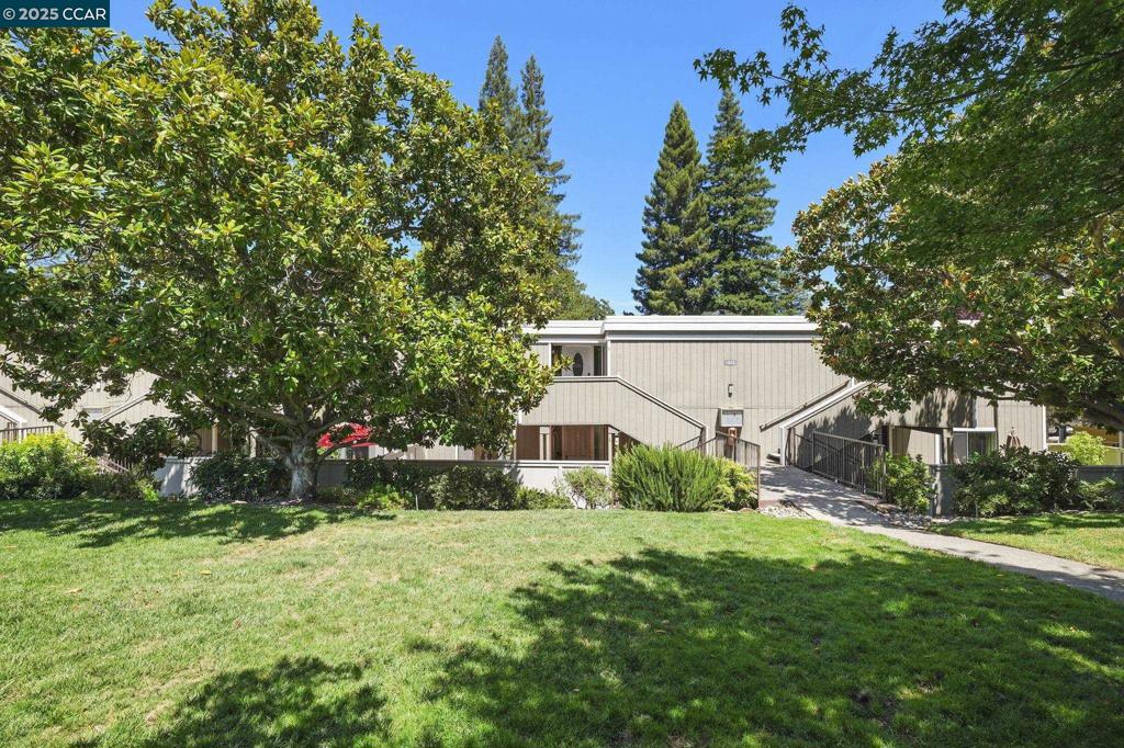 Spectacular setting surrounded by lush green common areas. Totally remodeled Carmel with 2 bedrooms and 1.5 baths. Coffered ceilings and recessed lighting. Wainscoting and crown molding throughout. Custom tile in kitchen and baths. Walk-in stall shower. Indoor washer/dryer unit. Two patios - front and back. Private and peaceful park-like setting. Rossmoor-At-Its-BEST. No need to preview!