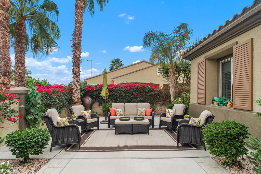 Experience resort-style living in this stunning Madera floor plan home, located in the highly sought-after Phase 3 of Sun City Shadow Hills. Perfectly positioned on the golf course, this home offers breathtaking views of the 7th green of the North Course, a tranquil lake, and the surrounding mountains. Whether you're relaxing by the pool or entertaining guests, this property provides the perfect backdrop for desert living at its finest. Step outside to your private oasis featuring a sparkling pool with a tanning shelf, a soothing spa, and brand-new outdoor furniture. Enjoy seamless indoor-outdoor living with a covered patio that offers plenty of space for dining, lounging, and soaking in the stunning views. Inside, this beautifully maintained 2-bedroom, 2-bath home includes a versatile den, perfect for a home office or additional guest space. Offered turnkey furnished, this home is move-in ready, allowing you to settle in with ease. The open-concept floor plan features a spacious living and dining area with large windows that flood the space with natural light. The well-appointed kitchen includes all appliances, a newer KitchenAid refrigerator, and additional beverage refrigerators, making it ideal for entertaining. The primary suite is a private retreat with gorgeous golf course views, a spacious en-suite bath, dual vanities, a walk-in shower, and a large walk-in closet. A comfortable guest bedroom and a second full bath provide plenty of space for visitors. The laundry room includes ample storage and a washer and dryer for added convenience. Located in the vibrant 55+ community of Sun City Shadow Hills, residents enjoy an array of amenities, including two championship golf courses, clubhouses, state-of-the-art fitness centers, pools, tennis and pickleball courts, and numerous social clubs and activities. The community also offers 24-hour gated security, walking trails, and a dog park.