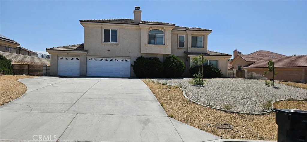 Located in the gated Ridge View Estates hilltop community, this luxurious Apple Valley home offers rich details and quality craftsmanship throughout. The grand foyer leads to formal living and dining rooms with private patio access. A first-floor bonus room is perfect for an office or den. The chef’s kitchen features stainless steel appliances, custom fridge, and large island opening to the spacious family room. The main-floor Master Suite boasts backyard access and a large closet. Upstairs, three guest bedrooms each have en-suite baths, plus a grand Master Retreat with fireplace, dual walk-ins, and spa-like bath. The backyard is a blank canvas for your personal touch. Additional highlights include energy-efficient lighting, 4x6 construction, security system, and oversized 3-car garage with epoxy flooring. Elegance and versatility in a prime location.