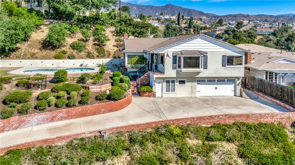 Welcome to this stunning Glendale Hills residence, offering breathtaking city views and unmatched curb appeal. Situated on a generous 13,600 sq. ft. lot, this beautifully maintained home spans approximately 2,440 sq. ft. of living space with 4 spacious bedrooms and 3 bathrooms.
Designed for both comfort and style, the home features an open and inviting floor plan with abundant natural light, perfect for entertaining or enjoying quiet evenings with family. The highlight of this property is the spectacular backyard oasis—complete with a sparkling pool that overlooks the city of Glendale, providing panoramic views both day and night.
With its ideal location, elegant design, and outdoor retreat, this property is a rare opportunity to own a truly special home in the prestigious Glendale Hills.