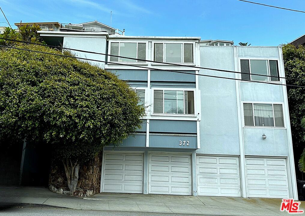 NEW PRICE! + Great Location! Desirable Playa Triplex property midway up "Little Pershing". Nestled (yes, nestled) in the Beach/Lagoon neighborhood of Playa Del Rey. Units One and Two Feature upgraded, large 3 Bedroom, 2 Bath (1932 sq ft. and 1620 sq ft. respectively). Both units have fireplaces fireplaces in the living room and an enclosed balcony off the kitchen. Top floor has mountain, Marina, and Ocean Views.Both have Primary suites with walk in closets,en suite bathrooms and balconies. Top unit has access to a decked yard, and with a little TLC can be the perfect Oasis for entertaining. Unit Three is a soon-to-be-permitted ADU, completely remodeled and a private garage. Building has 4 car garage spaces with storage and Community Washer and Dryer. Minutes to restaurants and coffee shops, Del Rey Lagoon Park, Silicon Beach and Ballona creek. Short drive to Marina Del Rey, Playa Vista and the Westside and LAX. Great Investment opportunity to acquire property in prime location with upside income potential.. Perfect for Owner/User or Investor. Urban, Beach Oasis in a well maintained building.