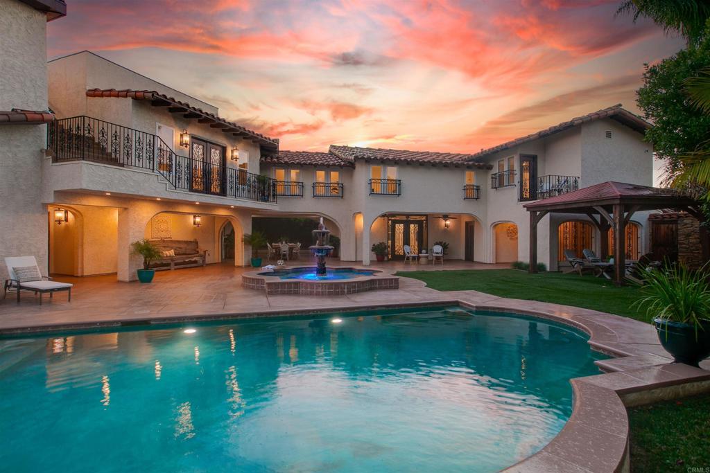 Escape to your private Tuscan paradise, majestically perched atop La Costa with commanding forever views of the Pacific Ocean. This over 6,000 sq. ft. custom estate is a rare opportunity, offering an unparalleled combination of privacy, luxury, and breathtaking views. *Entertainer's paradise: Multiple living and dining areas flow seamlessly into serene outdoor spaces, perfect for hosting any gathering. *Gourmet kitchen: A remodeled chef's kitchen boasts high-end appliances, an expansive center island, and an open layout that connects directly to the living room for effortless entertaining. Don't forget about the 1,200+ wine cellar room! * Resort-style pool and spa: The large jacuzzi and pool with a fountain create a focal point for fun and relaxation, enhancing the luxurious atmosphere. * Expansive master suite: This private sanctuary features two separate bathrooms, generous walk-in closets, and a private terrace – an ideal space for unwinding and enjoying the views. *Ample accommodations: With five spacious bedrooms and seven luxurious bathrooms, this estate provides ample space and privacy for family and guests. *Breathtaking views: Enjoy magnificent sunsets over the Pacific Ocean from nearly every room and the multiple terraces throughout the estate. *Unmatched privacy: Situated on a private lot with no rear neighbors, bordered by a peaceful canyon preserve, ensuring tranquility and seclusion. **This is more than a home; it's a lifestyle of comfort and convenience in one of North County's most desirable neighborhoods. Experience this magnificent retreat for yourself. Walk thru with the interactive 3D tour link. https://my.matterport.com/show/?m=3Ro1dVThUtQ&brand=0&mls=1&