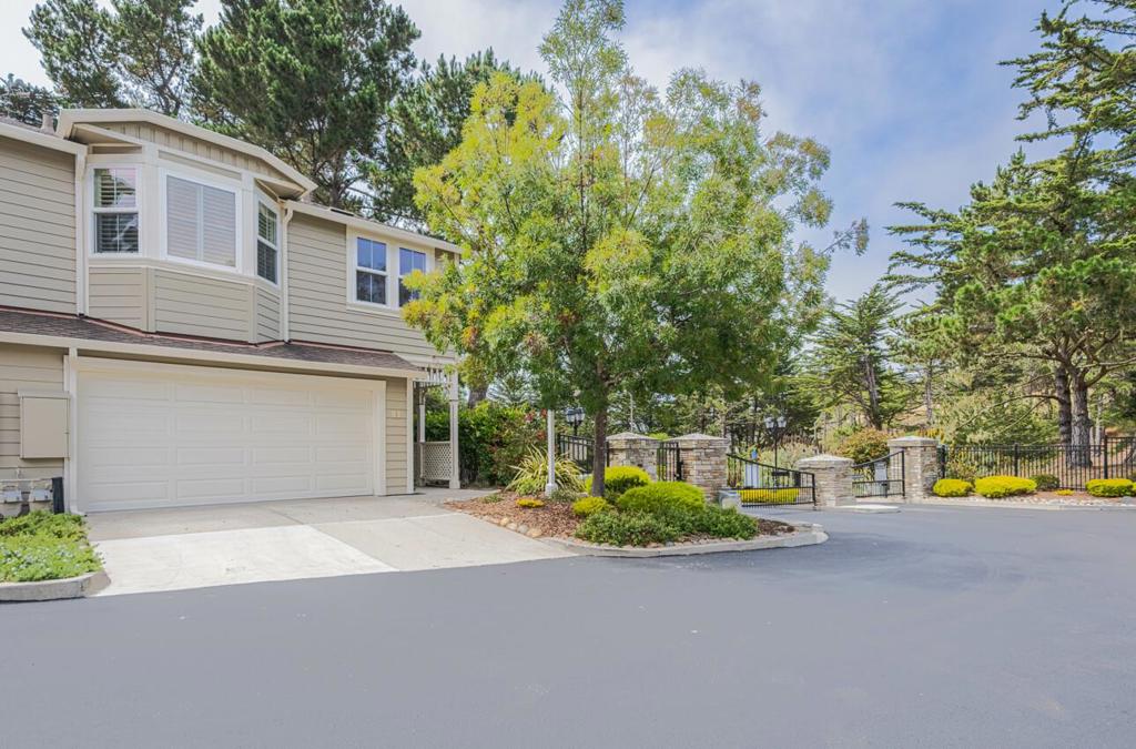 Located in the gated community of Glen Lakes with its picturesque lake, stream, and trees, this updated end unit was a prime lot when this development was built. Dual-pane windows, updated lighting, plantation shutters, updated kitchen and baths with new Quartz countertops make all the difference when choosing a move-in ready unit. This spacious 1,600 sq ft home offers two primary bedroom suites. If desired, the sitting room/office area of the junior primary suite was designed to be easily reconfigured into a 3rd bedroom - see the 2nd floor plan. Cozy up to the fireplace in the comfortable living room with views out the French doors to the oversized patio and green space. For your convenience, a washer and dryer are located in the attached two-car garage - right off of the kitchen. Outdoor enthusiasts will enjoy the tennis/pickle ball courts on site and the nearby park. Grocery stores, eateries, and a coffee shop are close by. The HOA covers the exterior including the roof and painting. Don't miss this chance to own in Pacific Grove and all it has to offer.