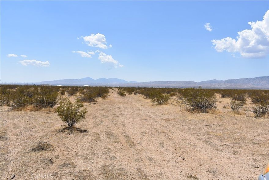 Light industrial and residential lot near the Mojave airport. The lot has 334 feet of frontage on Wilson Ave, and is the second lot west of 15th St E. APN 428-083-23.