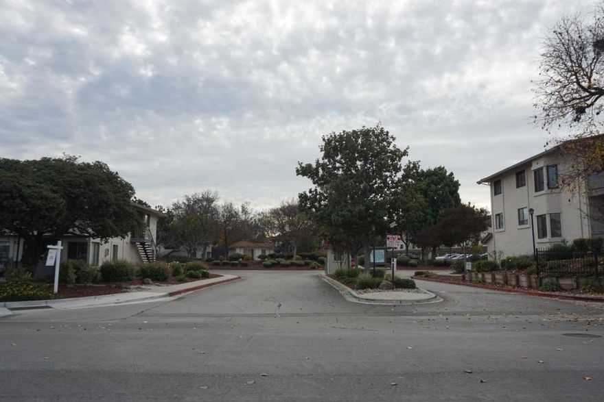 A rare, bright end unit location, no front neighbors, open greenbelt & play area in front of unit.  Great Location and ample guest parking , quiet community with pool, spa, tennis courts and club house.  A spacious 3 bedroom, 2 full bath, open floor plan with living & dining room. Bright Kitchen with lots of cabinet storage and modern appliances.  This unit includes updated bathrooms, inside washer & dryer, laminate floors, enclosed tandem 2 car garage, convenient shopping, restaurants, freeway 101 & 85 nearby.