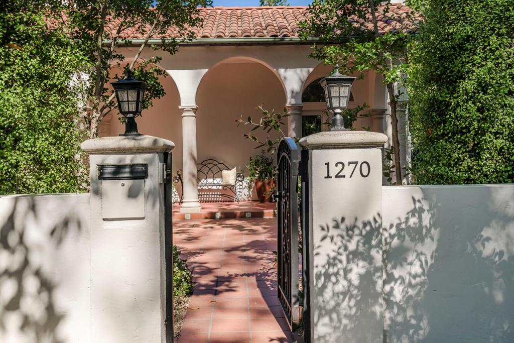 Lockbox on Thursday. A stunning home situated in the much sought after Crescent Park neighborhood. This home has been updated for today's living. Formal living room with a barrel ceiling, fireplace surrounded by bookcases and double doors to front patio and to the study. Formal dining room with large windows with a view to the garden. The open floor plan of the kitchen family room with eating area has granite counters, stainless appliances, and sliding door to covered porch. Four bedrooms with three bedrooms being en suites. One bedroom and bath is located on the ground floor. There is also a second study or meditation room. New paint, refinished inlaid hardwood floors and new lighting make this a move in ready home. Large lot with covered porches and hot tub is ideal for entertaining. Features include: AC, EV charger, gated front garden and driveway and close to downtown. Top Palo Alto schools.