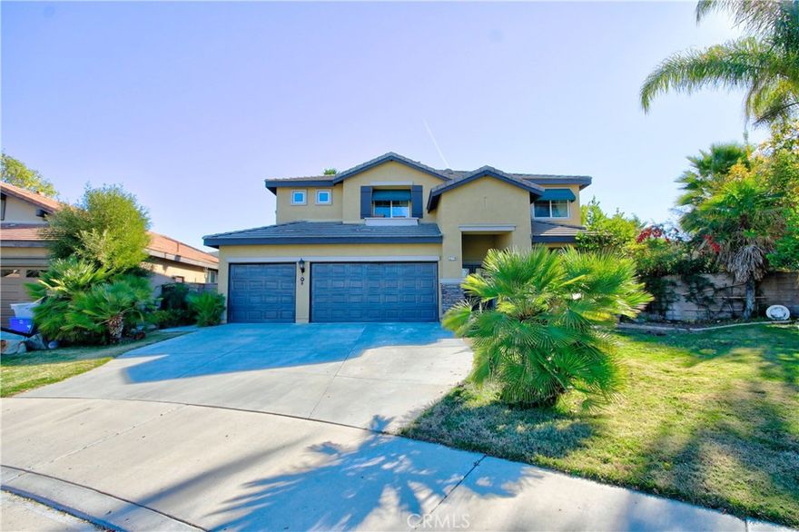 Located at the end of a cul-de-sac with a 3-car garage and a sprawling 15,682 sq ft parklike lot, this spacious Murrieta home has room for everyone.
Go inside to a bright and inviting layout featuring formal living and dining rooms, a versatile oversized loft, and a large family room with a cozy fireplace. The generous kitchen offers granite countertops, ample storage, center island for plenty of space for cooking and gathering. With 5 bedrooms and 3 bathrooms, this home provides exceptional flexibility—including a main-level bedroom and full bathroom, perfect for guests or multi-generational living. Upstairs, the expansive primary suite includes an en suite bathroom with a soaking tub and great natural light. The backyard is a true highlight—lush, private, and beautifully landscaped—with a covered patio ideal for dining, lounging, or entertaining. Mature trees and expansive green space create a serene, parklike retreat. An OWNED SOLAR system adds energy efficiency and savings. Located in the highly rated Murrieta School District and close to shopping, dining, and convenient freeway access, this home offers comfort, space, and an unbeatable location.