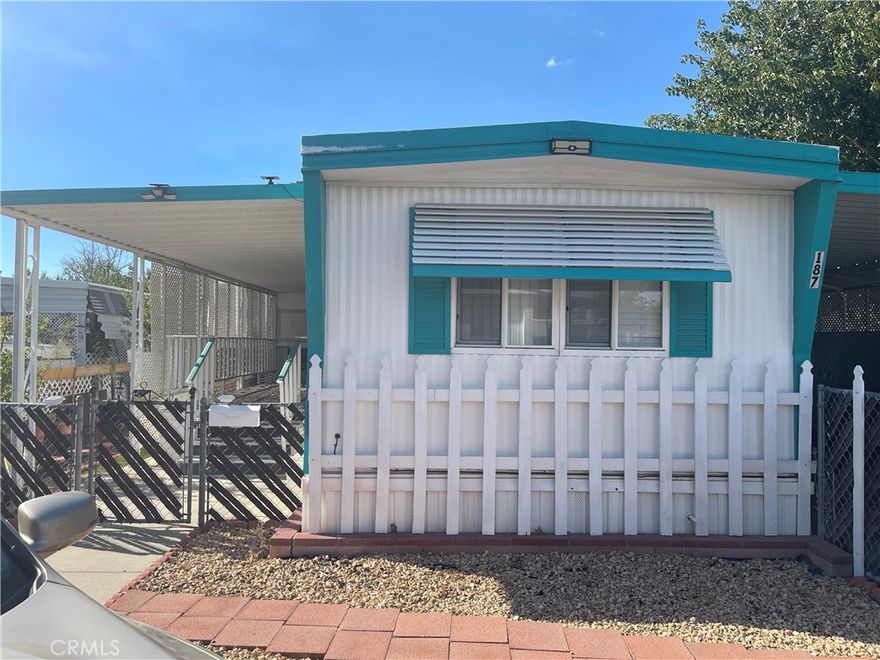 Well taken care of and in gorgeous shape. Situated in Thousand Elms Mobile Lodge, a 55 and up community. This cozy home boasts a spacious master bedroom with its own private bathroom. There are also 2 additional bedrooms and one full bath. Kitchen has plenty of cabinet space. Open living area with plenty of natural lighting. Glass sliding door leads out to a beautiful patio area. Well fenced in and around the property. Central heating and AC is included! Park requires application.