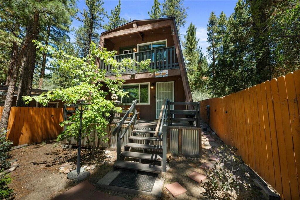 Escape to this adorable 2-bedroom, 1-bath, remodeled cabin in the highly desired area of lower Moonridge--just down from Bear Mountain Ski Resort, the golf course, and the Big Bear Alpine Zoo! This updated retreat is a guest favorite with a stellar rental history and all the comforts of home. Enjoy a warm, inviting, woodsy interior with modern touches, a full kitchen, a beautiful living room with a wood burning brick fireplace, and a stackable laundry unit for added convenience. Enjoy the mountain air and sunshine on your back deck and soak in the spa under the stars--fantastic after a day of skiing, hiking, or exploring the village. Whether you're sipping morning coffee surrounded by pines or cozying up by the fire, this cabin offers the perfect blend of charm and location. Come discover this gorgeous mountain getaway and make it your own personal escape!