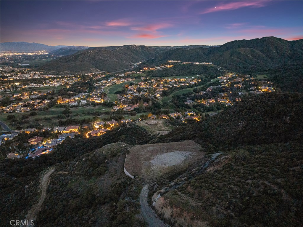Welcome to your dream property-Nestled in the heart of La Cresta, this vacant land is a canvas ready for your vision. Imagine waking up every morning to an endless horizon, breathtaking views and the serenity of nature right outside your door. Perfectly perched at the top of the hill taking full advantage of the stunning natural topography, this exceptional piece of land offers spectacular views of the entire valley, including the prestigious Bear Creek community and golf course. This property is more than just land—it’s a ready-to-build dream homesite. This rare 10 acre parcel includes professionally designed plans for a luxury residence, featuring: Architectural floor plans, Elevation designs, Garage floor plans,Site plan, Grading plan, Foundation design,Seismic engineering, Approved and signed-off engineered pad. With all major design and development steps already completed, this property offers an incredible opportunity to fast-track construction on your custom estate or luxury spec build. From sunrise to sunset, the views offer an ever- changing landscape that you'll never tire of. This is more than just land- it's a lifestyle. All while being just minutes from top-rated schools, shopping, dining, wineries, and quick freeway access. Whether you're looking to build your dream home or invest in one of the most sought-after regions in Southern California, this turnkey build-ready lot checks every box. A place where your vision can take root and flourish. Don't let this opportunity slip away, take the first step toward owning a piece of paradise.
