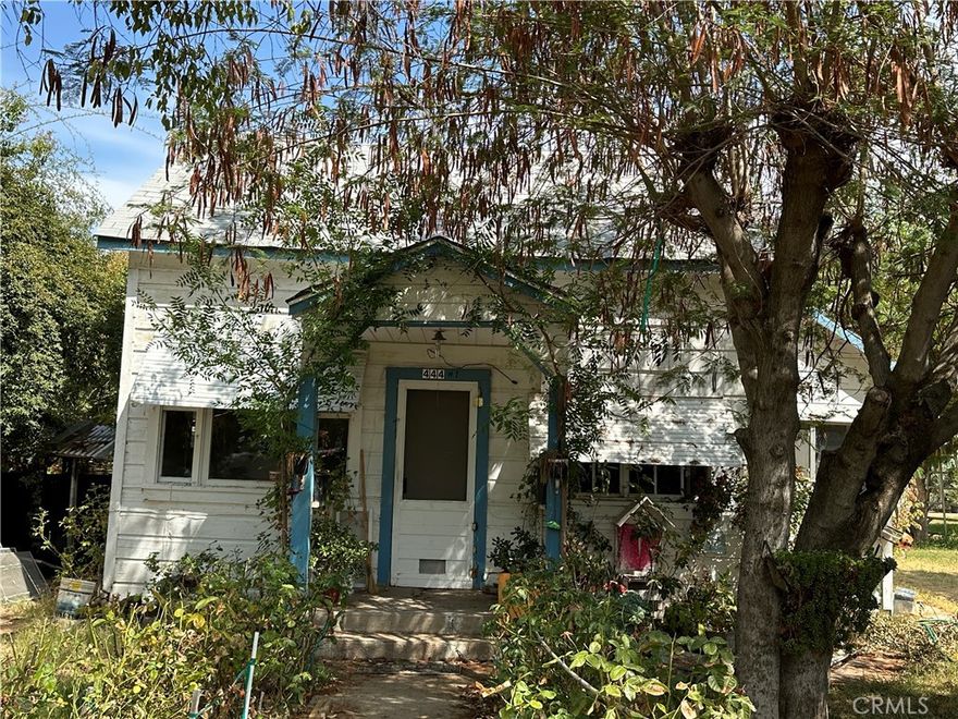 This 2 Br/2 Ba home comes with a tiny attached room, currently rented. Large shop.