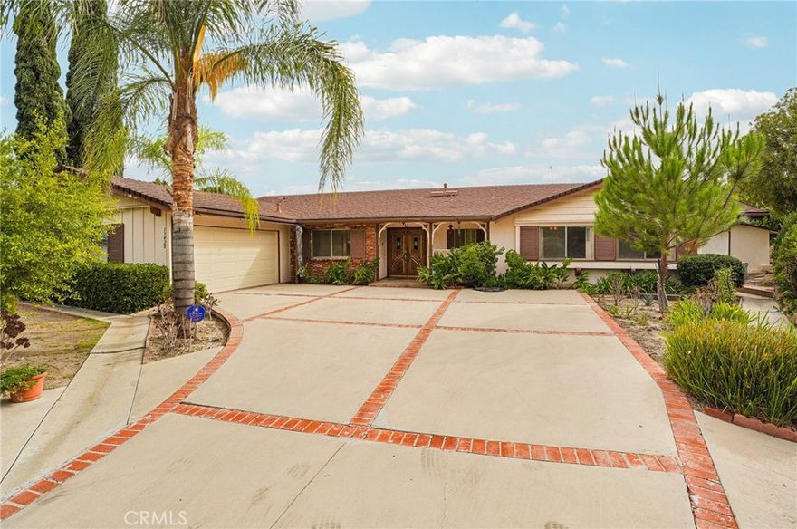 Located in Prime north of Rinaldi neighborhood of Granada Hills, this home offers ton of potential.  Features include 4 bedrooms, 2 full baths with over 2100 sqft of living space, large living room with gas fireplace, formal dining room, kitchen features a breakfast nook, family room/den leads you to the massive back yard just under 15,000 sqft with covered patio and multiple fruit trees.  Huge drive way leads you to the two car attached garage with direct access to the house.  Just minutes to the freeways and a 10 minute drive to the Vineyards at Porter Ranch.