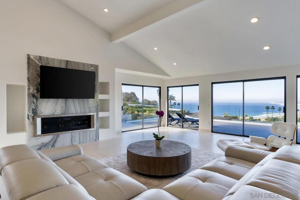 Welcome home to 7274 Via Capri in the prestigious La Jolla neighborhood of San Diego. Enjoy picturesque views of La Jolla's coastline and blue Pacific Ocean from your gorgeous large single-level family home! Indulge in luxury coastal living from the open living area with fireplace or from the large exterior deck perfect for al fresco dining and indoor/outdoor entertaining. Relax and recharge in the brand-new jacuzzi. The gourmet kitchen boasts stainless steel Wolf appliances, modern cabinetry, stone floors and counters, and large windows that expertly highlight the coastline views. The primary suite offers a spacious layout with a large closet and direct access to the ocean view deck. Step outside each morning and enjoy unparalleled views from your private terrace. The home also features a private garage and gated driveway for parking convenience. Situated in the highly sought-after La Jolla neighborhood, this home offers a prime location near La Jolla Shores, the Cove, La Jolla Village boutiques, live entertainment, and restaurants. This La Jolla residence comes furnished. Incredible views! Large living areas and outdoor terrace. Short-term rental available for $19,995 / month.