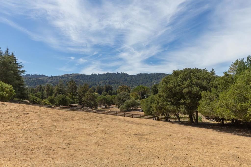 This 2.52 acre property in the desirable Westridge area of Portola Valley enjoys beautiful views and a park-like setting. A 3 bedroom, 2 bath main house features a spacious living/dining room with floor-to-ceiling windows and a cooks kitchen that opens to a separate family room while a 2 bedroom, 1 bath guest house lies adjacent to an in-ground pool. Completing the property is a 4-stall barn and an enclosed garden with raised planting beds and fruit trees.