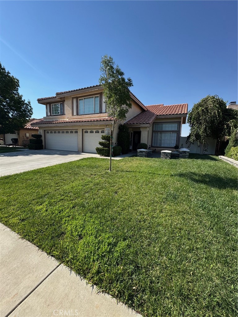 Welcome to 12342 Southwind Street, a beautiful two-story home in the highly sought-after Eagle Ranch neighborhood of Victorville. Offering 4 bedrooms and 3 bathrooms across 2,328 square feet, this home combines comfort, and style. Step inside to soaring vaulted ceilings and an open, airy layout filled with natural light. The interior features laminate flooring throughout, complemented by sleek tile in the bathrooms, while the open kitchen boasts white shaker cabinetry, quartz countertops, stainless steel appliances—perfect for both everyday living and entertaining. A cozy fireplace in the living area creates a warm focal point for relaxing evenings. Upstairs, all four bedrooms are generously sized, including a spacious master suite. Outside, a new vinyl fence provides added privacy, the front yard is beautifully landscaped, and the 3-car attached garage offers plenty of space for vehicles and storage. Nestled on a 7,261-square-foot lot in a quiet, family-friendly neighborhood, this home offers the perfect blend of charm, modern upgrades, and a peaceful setting.