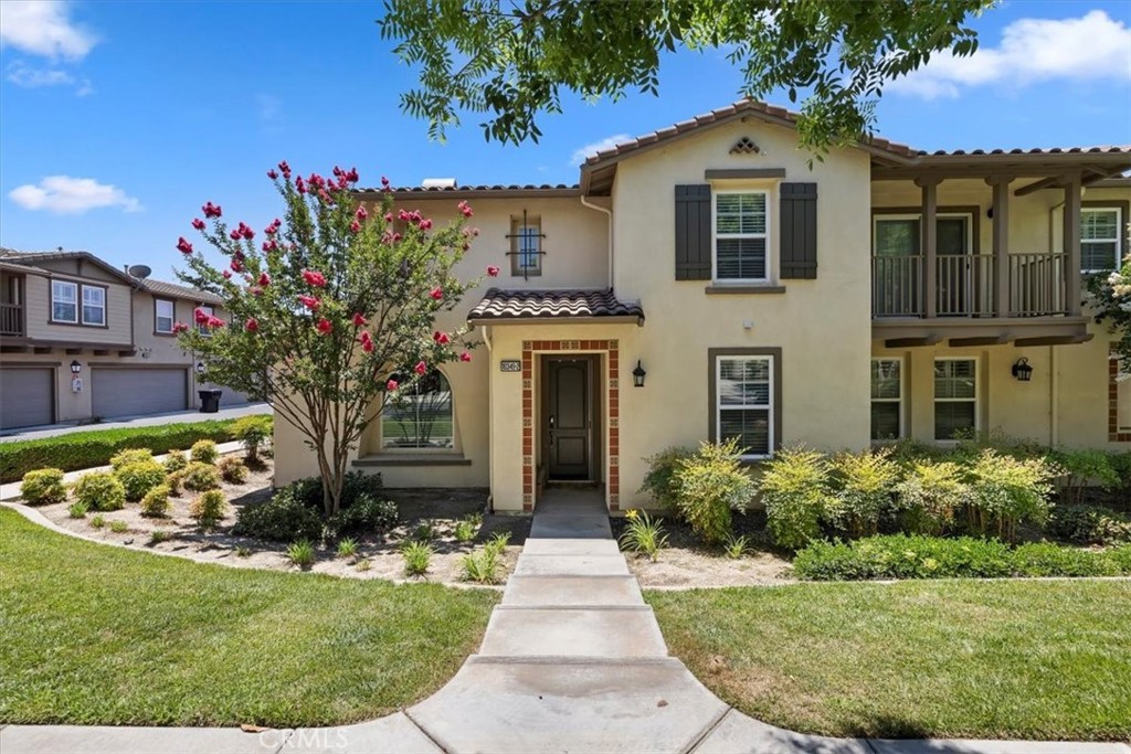 Welcome to the highly desirable gated community of Vintner's Grove. This stylish corner-unit 4 bed, 3 bath home features rich hardwood flooring, granite kitchen counters, stainless steel appliances, and a large center island that opens to a spacious dining area—perfect for everyday living and entertaining. The living room offers a cozy fireplace and built-in media niche, while a versatile downstairs room with a nearby ¾ bath can easily be used as a home office or converted into a 4th bedroom. Upstairs, the primary suite includes a walk-in closet and a private bath with dual sinks, a soaking tub, and a separate shower. Enjoy a sunny private patio with peek-a-boo mountain views, indoor laundry, and the benefits of low-maintenance living. Community amenities include a sparkling pool, spa, wading pool, playground, BBQ area, picnic tables, and a peaceful vineyard and rose garden. Conveniently located near shopping, restaurants, schools, and parks: this home offers the perfect balance of comfort, function, and an active lifestyle.
