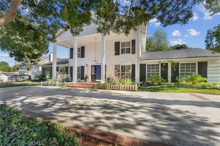 Welcome to this beautifully maintained Colonial-style home in the highly sought-after Upper South Redlands area. Ideally located within walking distance to Redlands Country Club and Prospect Park, this home sits on a lushly landscaped .34-acre lot with tranquil views of the San Bernardino Mountains, Redlands city lights, and a private backyard retreat. Enjoy the peaceful greenery surrounding the expansive backyard and 28,000-gallon pool, complete with upgraded VFD pump, diving board, multiple lounging areas, and an upper fire pit perfect for star-filled evenings. The property also features a brick entry, paved driveways, a 12-ft automatic gate with battery backup, and a blend of new wrought iron, vinyl, and wood fencing.
Inside, the home offers 5 bedrooms and 3 bathrooms across 2,208 sq ft of remodeled living space. Upgraded utilities include a new smart water meter, main water line, regulator, and expanded electrical panels with future capacity, plus gigabit high-speed internet and a new 30-year roof with solar conduit pathway. The large chef’s kitchen boasts top-tier soft-close shaker cabinets, high-end granite counters, elegant subway tile, modern LED lighting, and premium appliances including a 5-burner high-heat cooktop with 50,000 BTU super-burner, double convection ovens, oversized microwave, pot filler, wine fridge, dishwasher, and Bluetooth features. The floor plan includes a formal living room with wood-burning fireplace, a spacious family room, dining room, and breakfast nook with dual French doors opening to the backyard for seamless entertaining. Additional upgrades include a remodeled powder room, indoor laundry, custom casing and molding, new paint, newer dual-pane windows with plantation shutters, and 100% waterproof/ fireproof luxury vinyl plank flooring. The first-floor primary suite offers an oversized jetted tub, large walk-in shower, and new fixtures. An oversized 503 sq ft 2-car garage/shop provides extensive power with three 220V/50A outlets and five 20A circuits—ideal for RV, EV, or workshop use. Don’t miss this exceptional opportunity in one of Redlands’ most desirable neighborhoods.